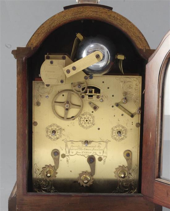 A silver mounted mahogany quarter chiming table clock, by J.W. Elliott Ltd for Garrard, 15in.